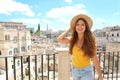 Happy cheerful tourist girl visiting Matera, Italy Royalty Free Stock Photo