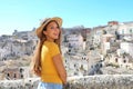 Happy cheerful tourist girl visiting Matera, Italy Royalty Free Stock Photo