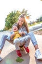 Happy cheerful Young family, little boy 3-5 years old, mother woman, have fun having, in summer in a city park. Weekend Royalty Free Stock Photo
