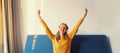 Happy cheerful young woman listening to music with headphones having fun at home Royalty Free Stock Photo