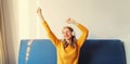 Happy cheerful young woman listening to music with headphones having fun at home Royalty Free Stock Photo