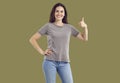 Happy cheerful young woman showing thumb up amiling at camera Royalty Free Stock Photo