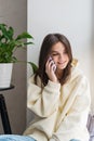 Happy cheerful young woman talking on the phone at home, smiling teenage girl answering a call on a mobile phone. Soft selective Royalty Free Stock Photo