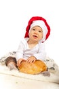 Happy chef baby with bread