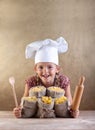 Happy chef child with pasta assortment