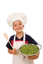 Happy chef with lots of fresh green peas Royalty Free Stock Photo