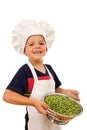 Happy chef with lots of fresh peas Royalty Free Stock Photo