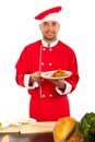 Happy chef showing food on plate