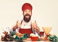 Happy Chef standing over ingredients and showing thumbs up. Royalty Free Stock Photo