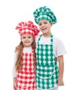 Happy chefs - boy and girl with aprons and hats Royalty Free Stock Photo