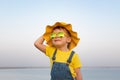 Happy child against blue sea and sky background Royalty Free Stock Photo