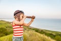 Happy child against blue sea and sky background Royalty Free Stock Photo