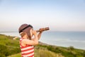 Happy child against blue sea and sky background Royalty Free Stock Photo