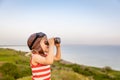 Happy child against blue sea and sky background Royalty Free Stock Photo