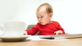 Happy child baby girl toddler sitting with keyboard of computer isolated on a white background Royalty Free Stock Photo