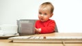 Happy child baby girl toddler sitting with keyboard of computer isolated on a white background Royalty Free Stock Photo