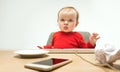 Happy child baby girl toddler sitting with keyboard of computer isolated on a white background Royalty Free Stock Photo