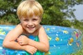 Happy Child in Baby Pool Royalty Free Stock Photo