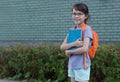 Happy child back to school.School girl carry backpack .