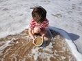 Happy child on the beach in the spring