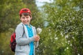 Happy child blowing dandelion flower outdoors. Boy having fun in spring park. Blurred green background Royalty Free Stock Photo