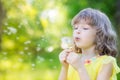 Happy child blowing dandelion flower outdoors Royalty Free Stock Photo