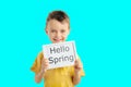 child boy  holding a poster for your information on the blue background Royalty Free Stock Photo