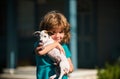 Happy child boy hugging dog, hug friends. Royalty Free Stock Photo