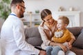 Happy child boy patient with his mother at reception of a friendly pediatrician family doctor family pediatrician Royalty Free Stock Photo