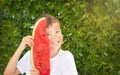 Happy child boy with a red juicy, tasty watermelon. Caucasian kid smiling and having fun. Concept of healthy food.