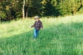 Happy child boy running on meadow in summer Royalty Free Stock Photo