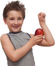 Happy child boy showing muscle apple