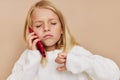 happy child communication smartphone entertainment on a beige background