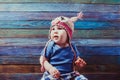 Happy child in cute crocheted owl hat