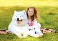 Happy child and dog resting on the grass Royalty Free Stock Photo