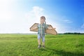 Happy child dreams of traveling and playing with an airplane pilot aviator in outdoor in the summer. Start traveling Royalty Free Stock Photo