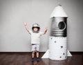 Happy child dressed in an astronaut costume