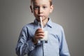 Happy Child drinking milk.Little Boy enjoy milk cocktail Royalty Free Stock Photo