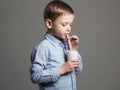 Happy Child drinking milk.Little smiling Boy enjoy milk cocktail Royalty Free Stock Photo