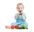 Happy child eating healthy food vegetables Royalty Free Stock Photo