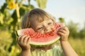 Happy child eating watermelon in the garden Royalty Free Stock Photo