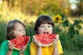 Happy child eating watermelon in garden. Royalty Free Stock Photo