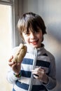 Child eats big homemade bread Royalty Free Stock Photo