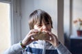 Child eats big homemade bread Royalty Free Stock Photo