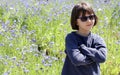 Happy child enjoying relaxing sun, observing nature at springtime Royalty Free Stock Photo