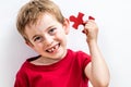 Happy child finding jigsaw for concept of solution to healthcare Royalty Free Stock Photo