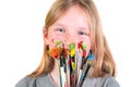 Happy child girl artist with brushes and palette in hands on white background. Painting education concept, art school Royalty Free Stock Photo