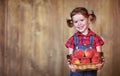 Happy child girl with a basket of peaches Royalty Free Stock Photo