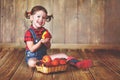 Happy child girl with a basket of peaches Royalty Free Stock Photo