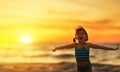 Happy child girl in bikini on beach in summer sea Royalty Free Stock Photo